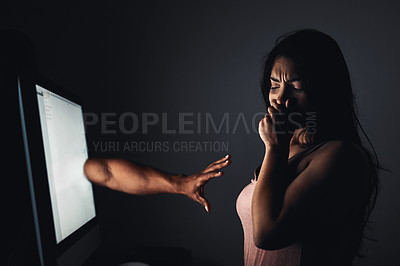 Buy stock photo Shot of a hand extending from a computer screen towards young woman