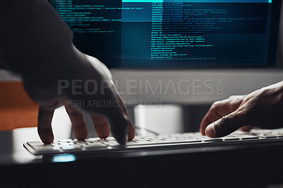 Buy stock photo Shot of an unrecognisable hacker using a computer in the dark