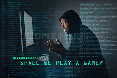 Buy stock photo Shot of a hacker cracking a computer code in the dark