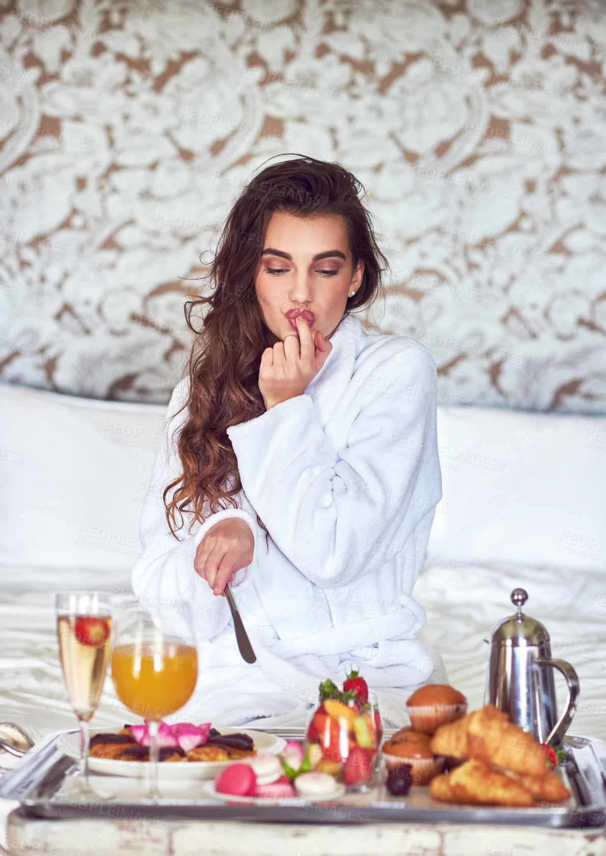 Buy stock photo Hotel, bed and woman with breakfast, room service or taste with healthy meal with food, hospitality or break. Person, eating or girl with nutrition, luxury or vacation with comfort, hungry or morning