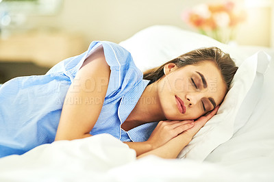 Buy stock photo Cropped shot of an attractive young woman asleep in her bed