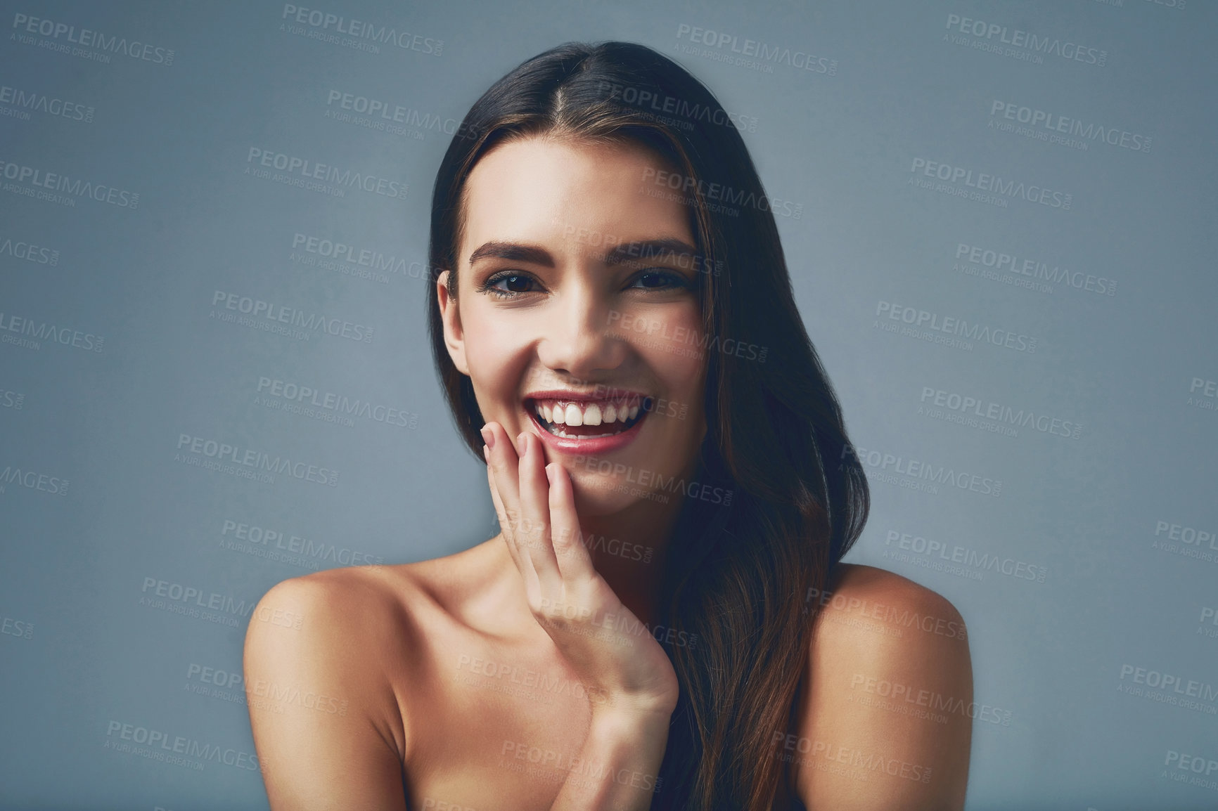 Buy stock photo Beauty, laughing and portrait of girl for skincare on grey background for smooth face, detox or natural glow. Facial, smile and happy woman in studio with cosmetics, shine or transformation results