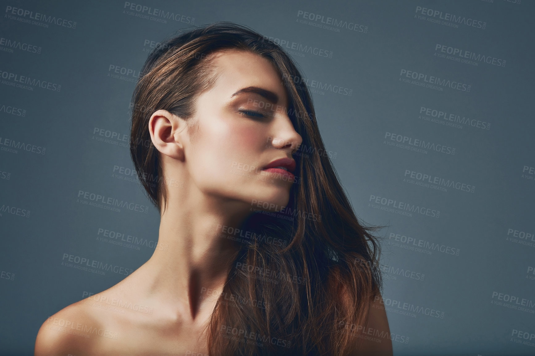 Buy stock photo Beauty, face and hair with natural woman in studio isolated on blue background for skincare. Aesthetic, cosmetics and dermatology with confident model at salon for keratin or shampoo treatment