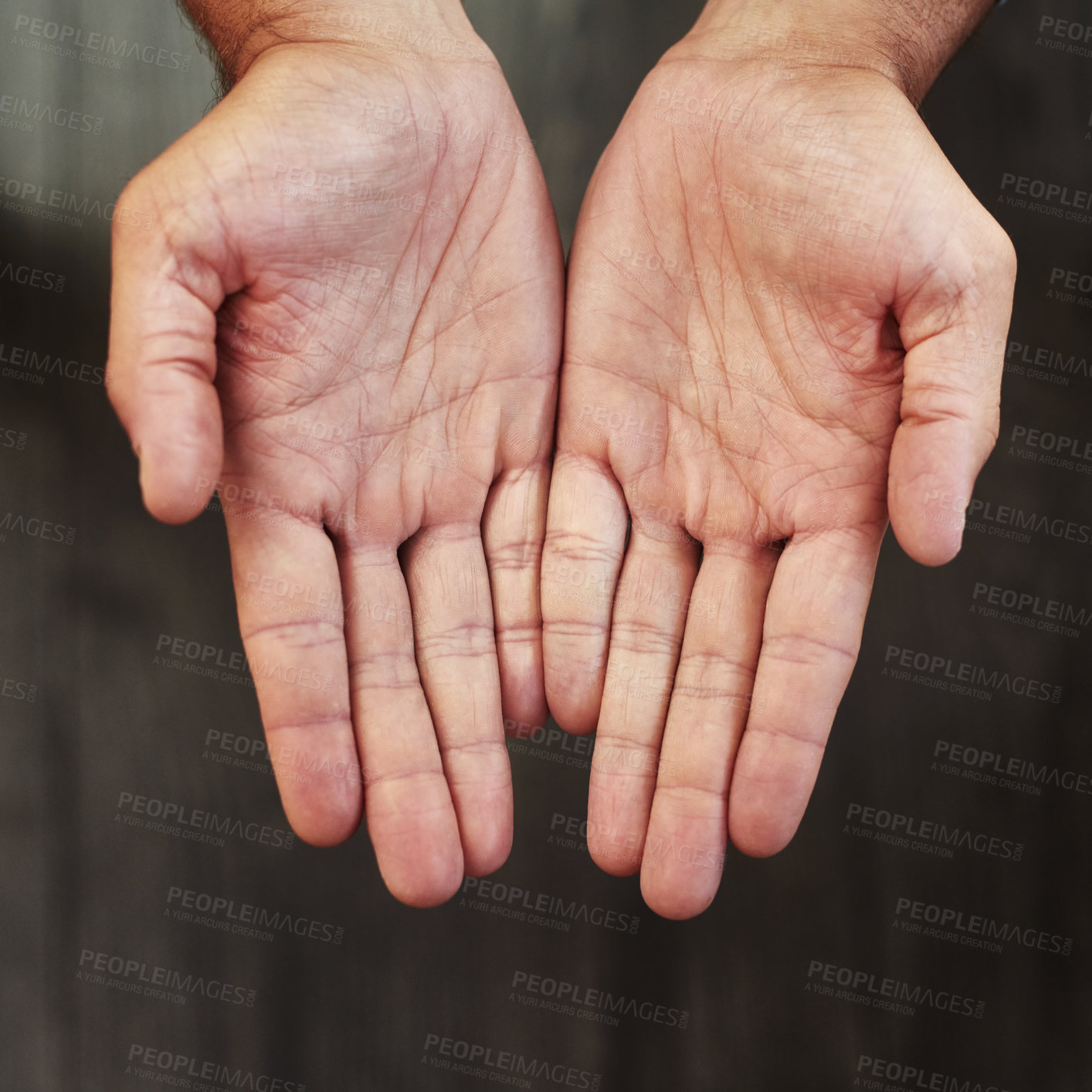 Buy stock photo Studio shot of an unrecognizable person's open hands shown against a dark background