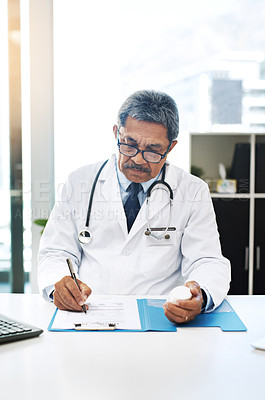 Buy stock photo Mature man, doctor and writing prescription with medication at office for patient for healthcare. Male person, medical practitioner and file or folder at clinic with personal information and records