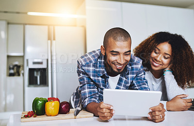 Buy stock photo Couple, tablet and cooking with recipe in kitchen at home for food blog, internet website and online connection. Happy man, woman and digital technology for reading healthy vegan meal instructions 