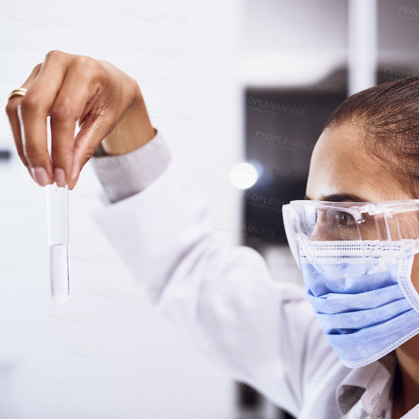 Buy stock photo Shot of a young scientist working in a lab