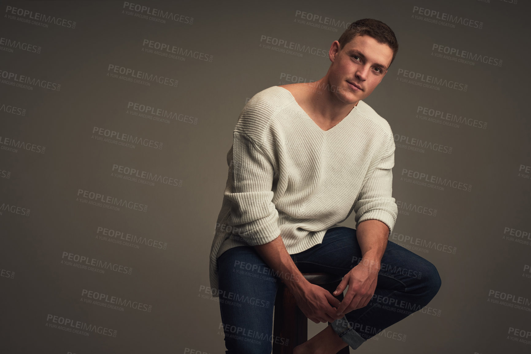 Buy stock photo Man, portrait and chair on studio background for fashion, style and trendy men clothes with shirt. Male person, face and mockup space for confidence, aesthetic and corduroy fabric with jeans as model