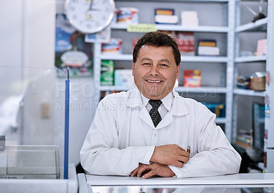 Buy stock photo Mature man, pharmacy and smile in portrait by counter, pride and healthcare services at retail store. Person, pharmacist and happy shop owner with confidence for drugs, pills and sales in Colombia