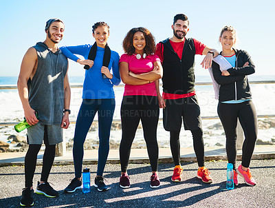 Buy stock photo Portrait of a cheerful young group of friends standing together before a fitness exercise outside during the day