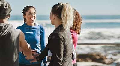 Buy stock photo Cropped shot of a fitness group talking while out for a run