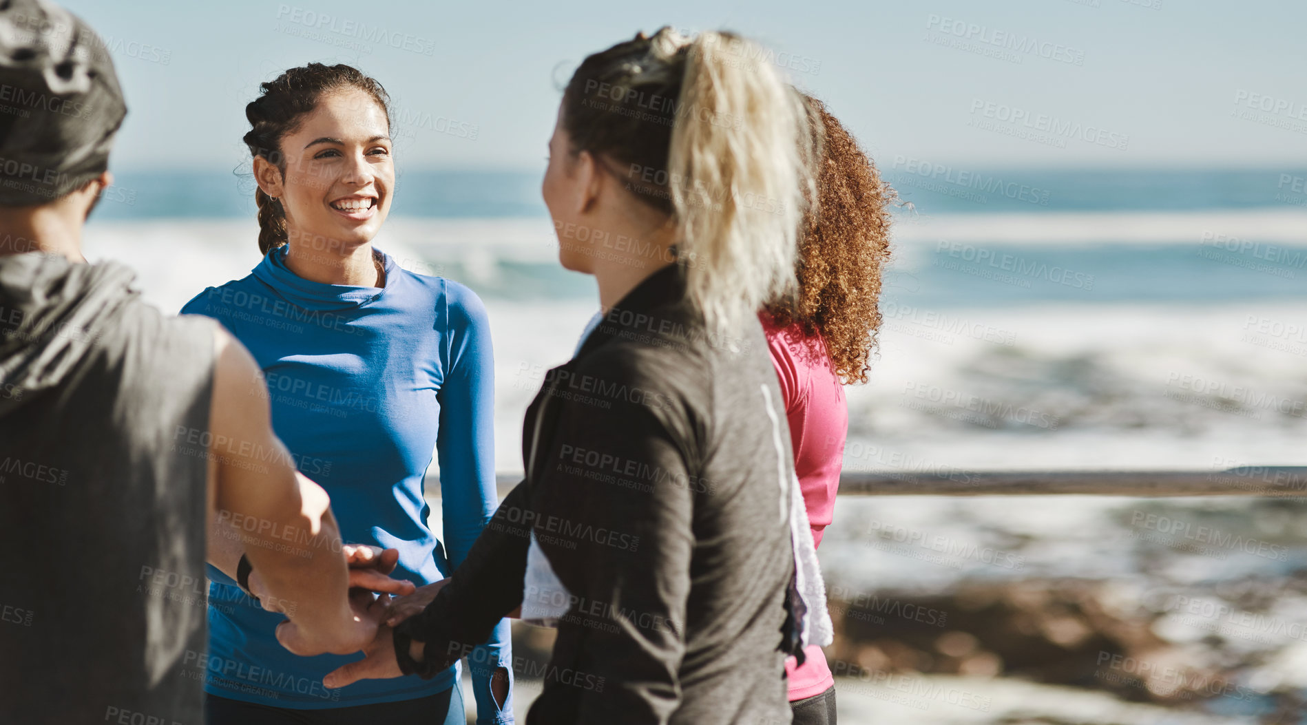 Buy stock photo Cropped shot of a fitness group talking while out for a run