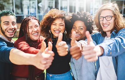 Buy stock photo Cropped portrait of a diverse group of college friends giving thumbs up while standing outside