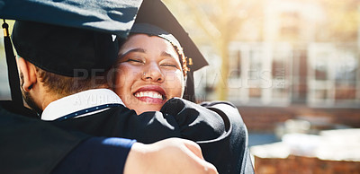 Buy stock photo Cropped shot of a young woman embracing her male friend after graduating