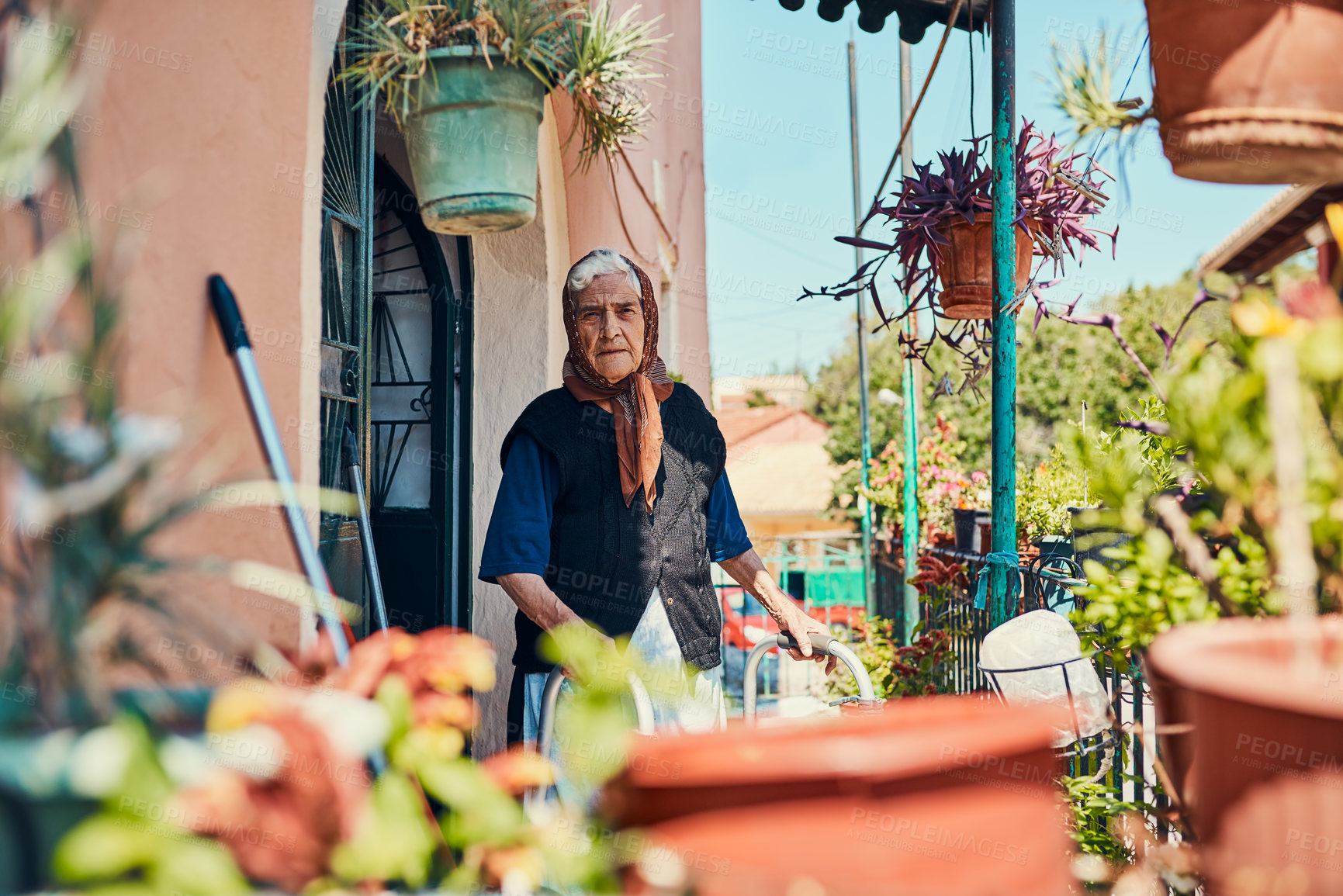 Buy stock photo Portrait of a senior woman standing on her front porch in an ancient city