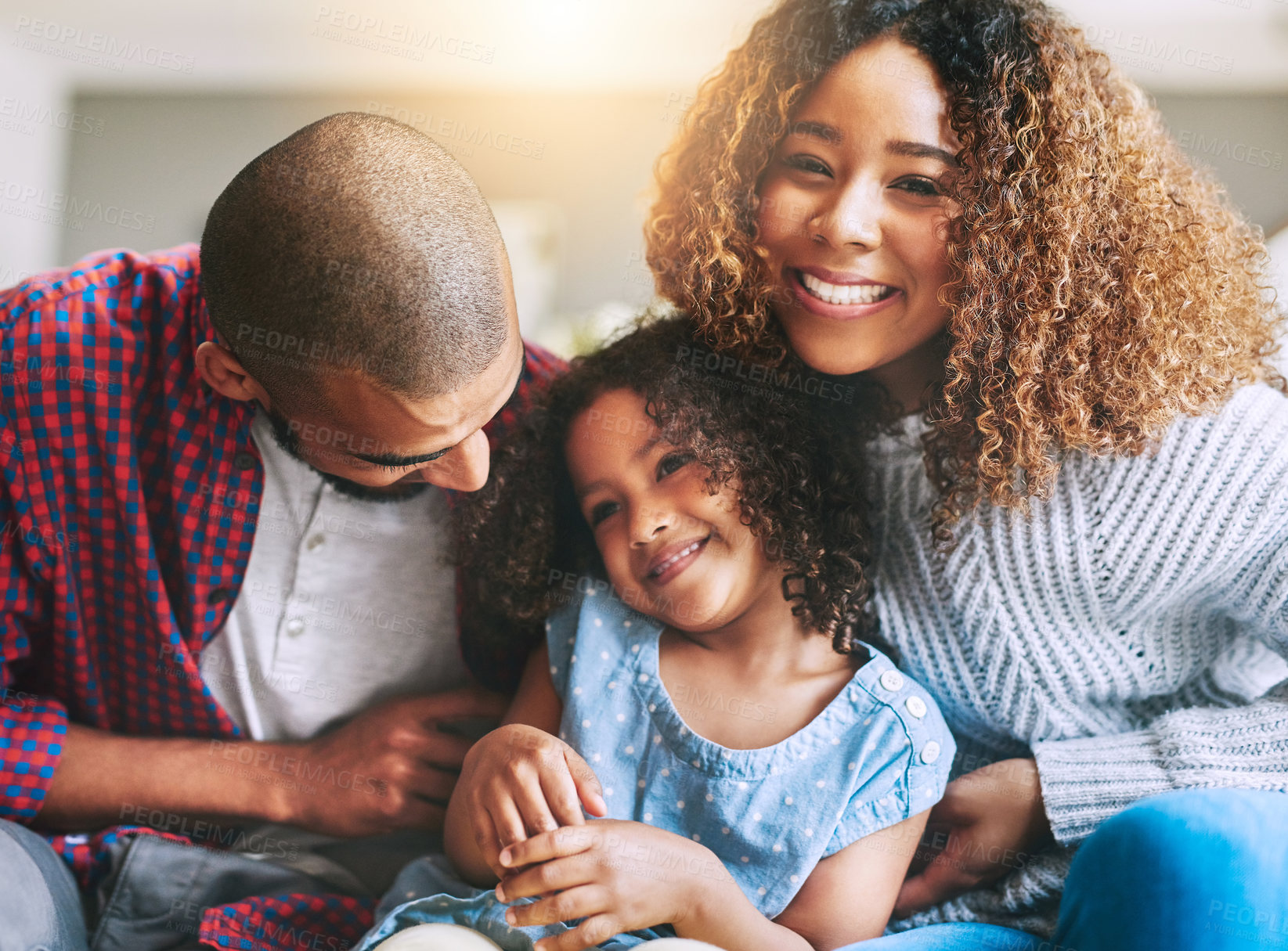 Buy stock photo Happy family, portrait and laugh relaxing together with sofa, support and bonding in home. Man, woman and parents with excited daughter and smile on couch in house living room for weekend care