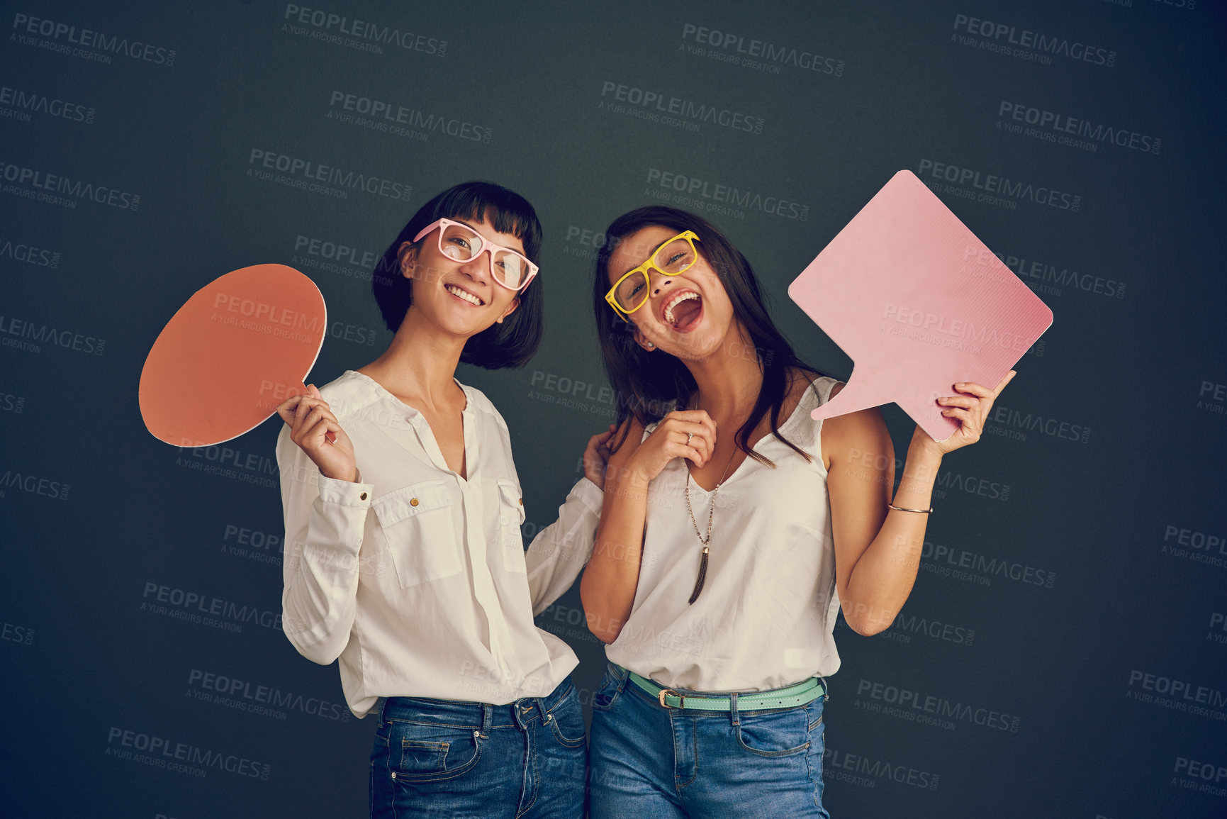 Buy stock photo Portrait, women and speech bubble for news in studio of presentation feedback, opinion sign and planning launch. People, poster space and announcement info with advertising glasses on dark background