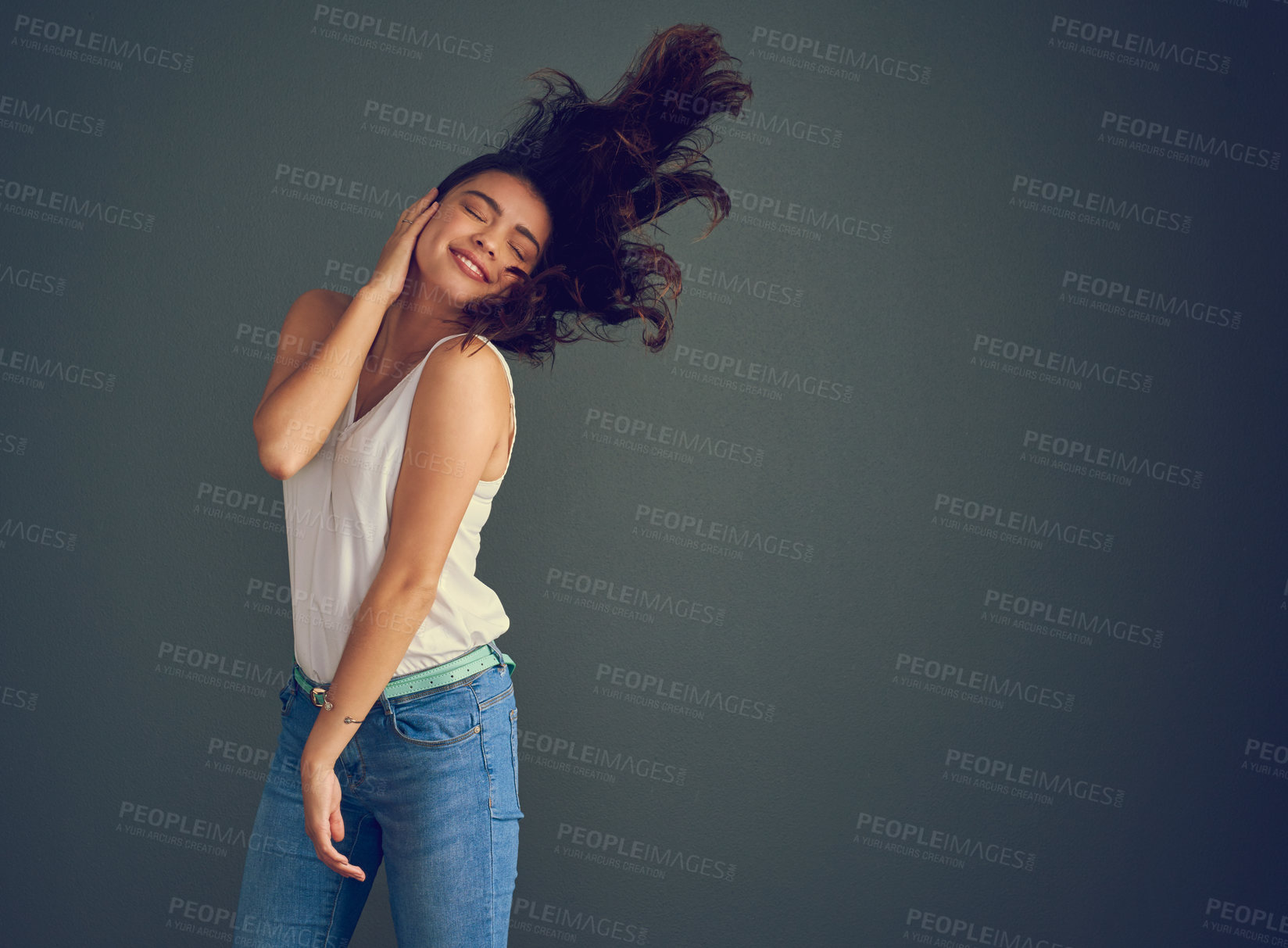 Buy stock photo Fashion, mockup and and wind with woman in studio isolated on dark background for wardrobe style. Hair, dancing and energy with happy person in breeze for trendy clothes or relaxed outfit in space