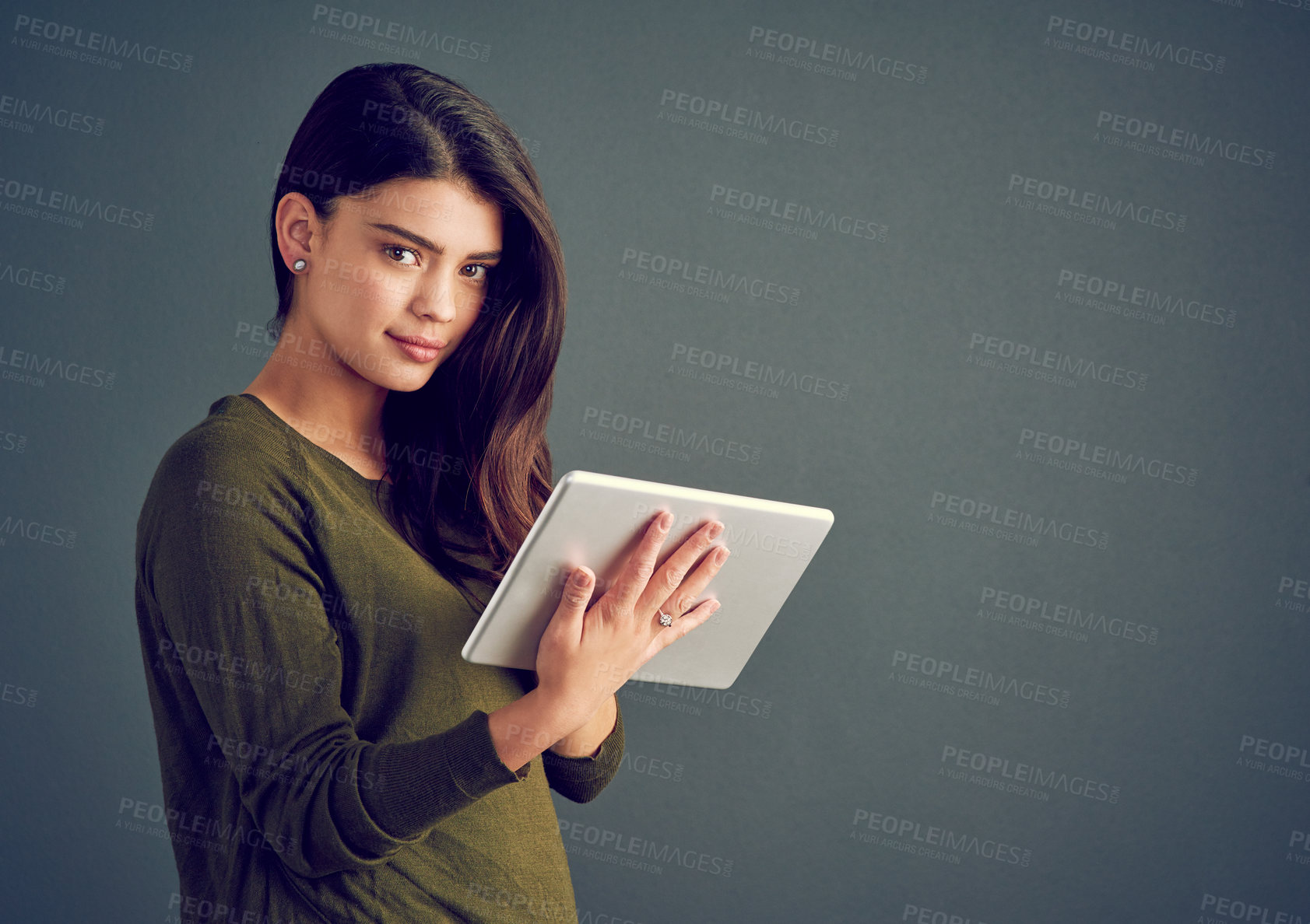 Buy stock photo Tablet, woman and portrait in studio with hair care, smile and research for treatment options. Girl, tech and typing on gray background space for connectivity, keratin information or booking at salon