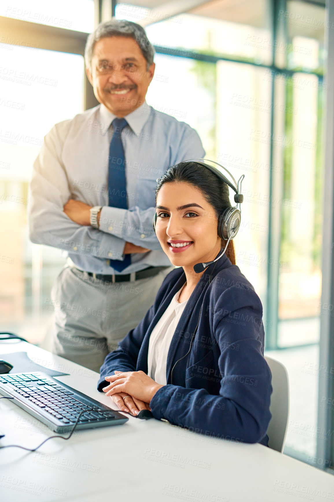 Buy stock photo Cropped portrait of a female customer service representative and her supervisor at work in her office