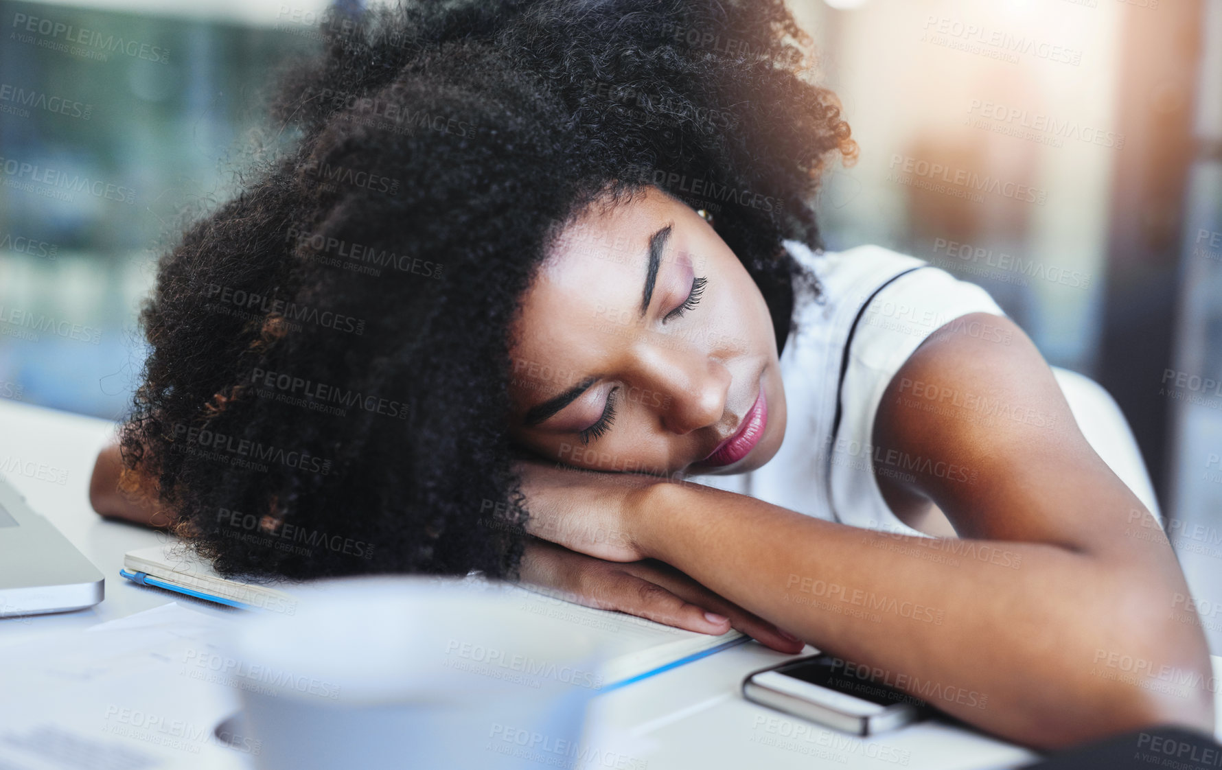 Buy stock photo Cropped shot of an attractive young businesswoman sleeping on her desk in her office