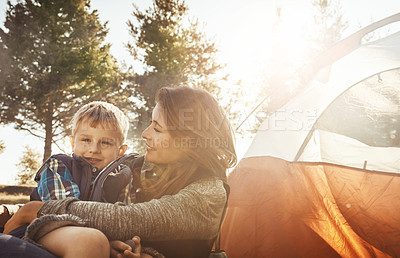 Buy stock photo Shot of a young beautiful mother and her son camping in the forest