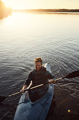 Buy stock photo Man, rowing and outdoor with river or kayak for water sports, thinking and lake journey on summer vacation. Person, canoeing and above on holiday in nature with sunshine, adventure and paddle boat.