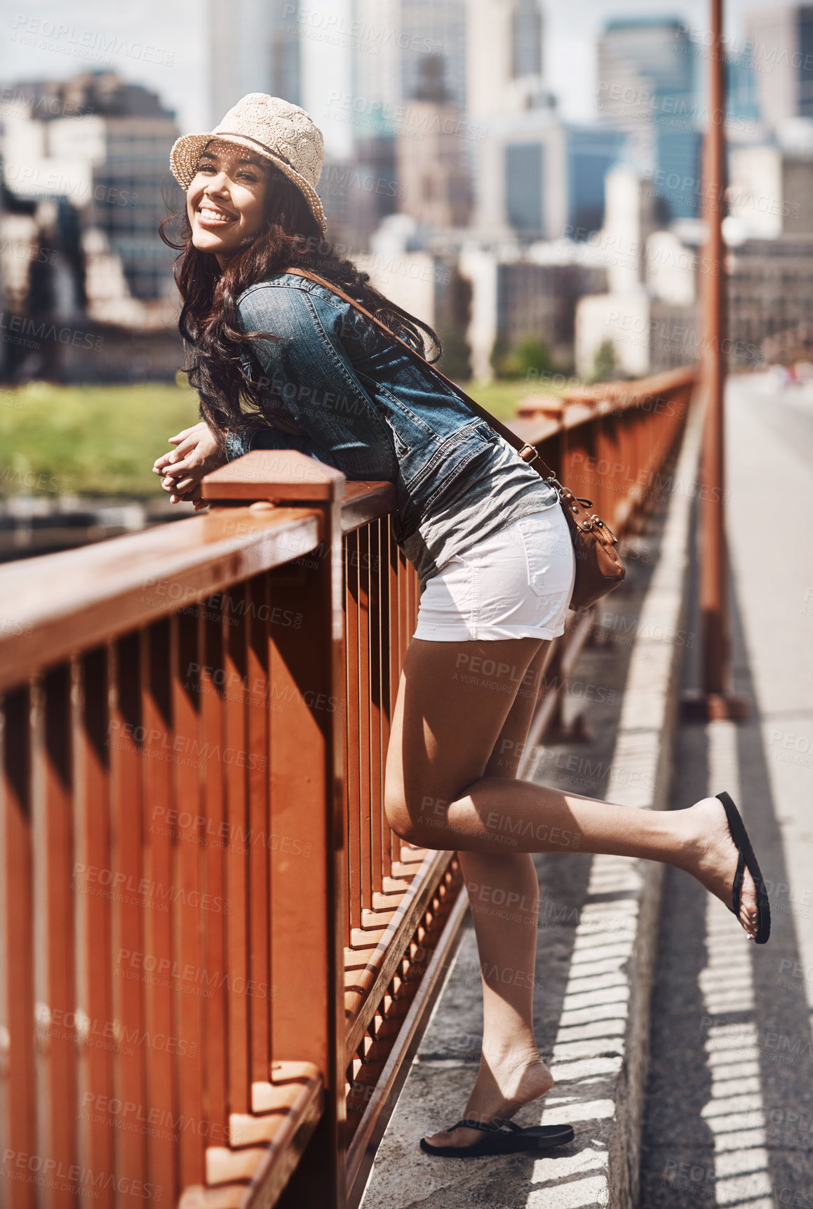 Buy stock photo Shot of a beautiful young woman spending her day in the city