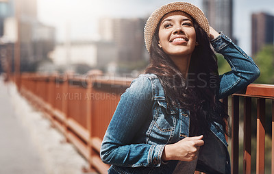 Buy stock photo Shot of a beautiful young woman spending her day in the city