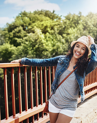 Buy stock photo Shot of a playful young woman spending the day outdoors