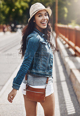 Buy stock photo Shot of a beautiful young woman spending her day in the city