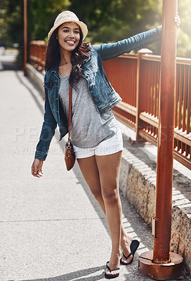 Buy stock photo Shot of a playful young woman spending the day outdoors
