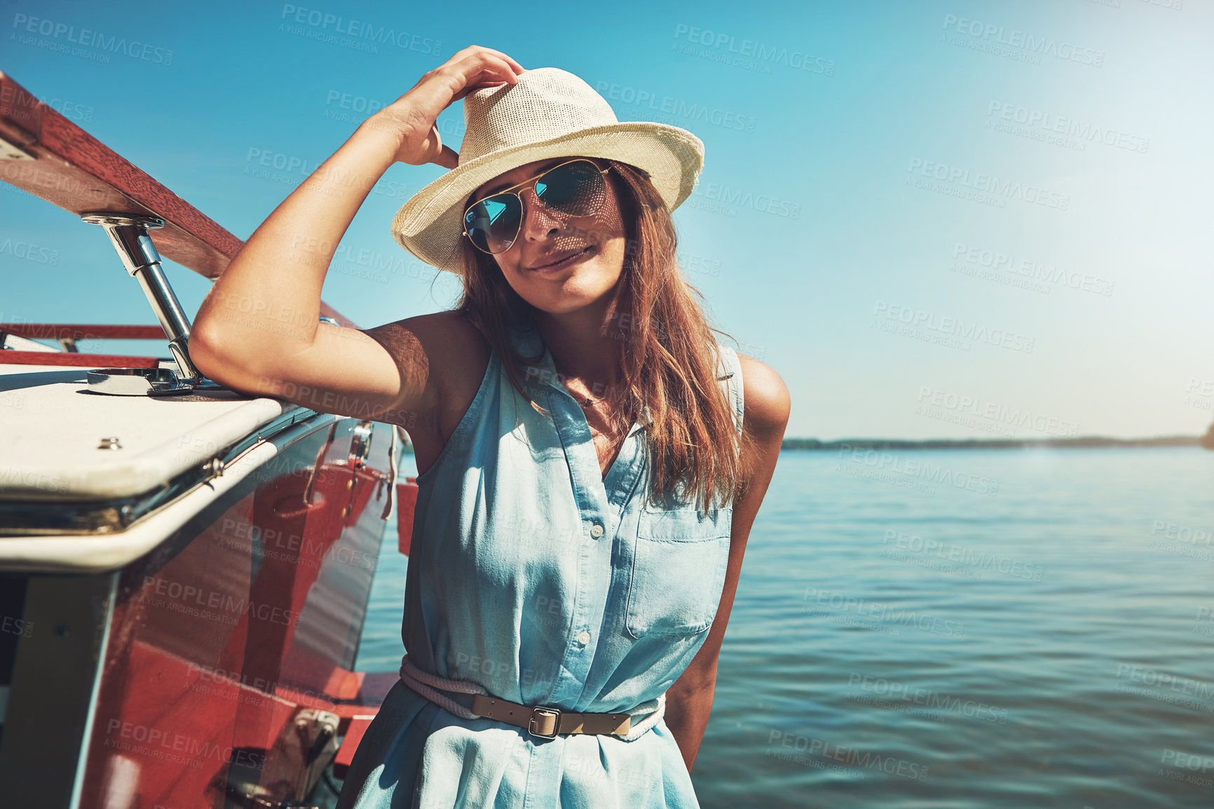 Buy stock photo Cruise, portrait or happy woman on yacht on ocean for travel, holiday vacation or summer trip. Relax, cool sunglasses or girl tourist with smile, hat or fashion on boat on sea for weekend in Greece