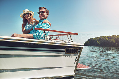 Buy stock photo Portrait of a young couple spending time together on a yacht