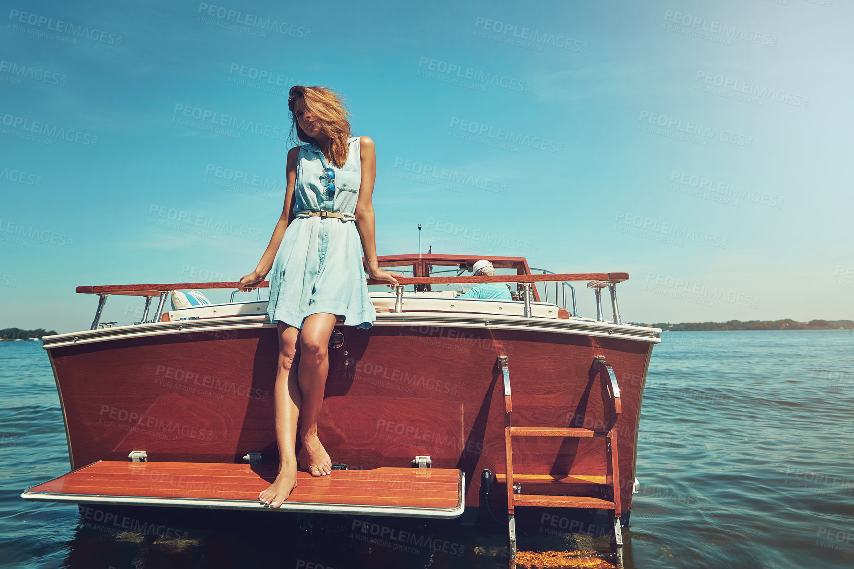 Buy stock photo Blue sky, standing and woman on boat by ocean for travel, vacation or holiday with adventure. Happy, explore and female person on deck of yacht by sea water for tropical summer weekend trip in Italy.