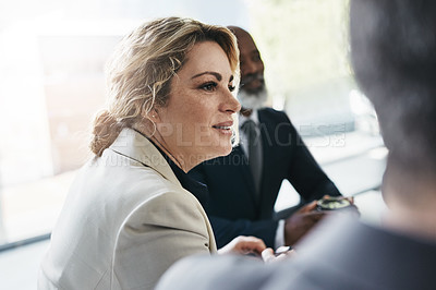 Buy stock photo Shot of a businesswoman having a meeting with her colleagues in an office