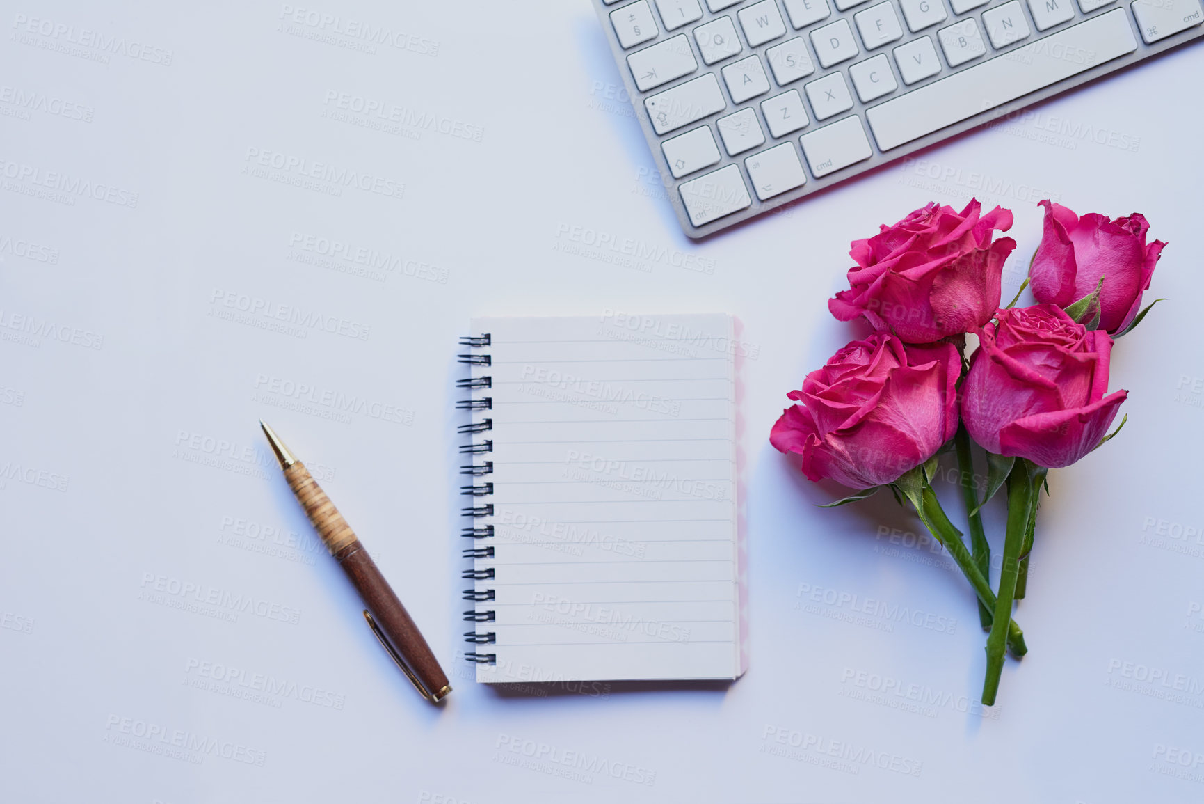 Buy stock photo Studio shot of a diary and pen placed with other still life objects against a grey background