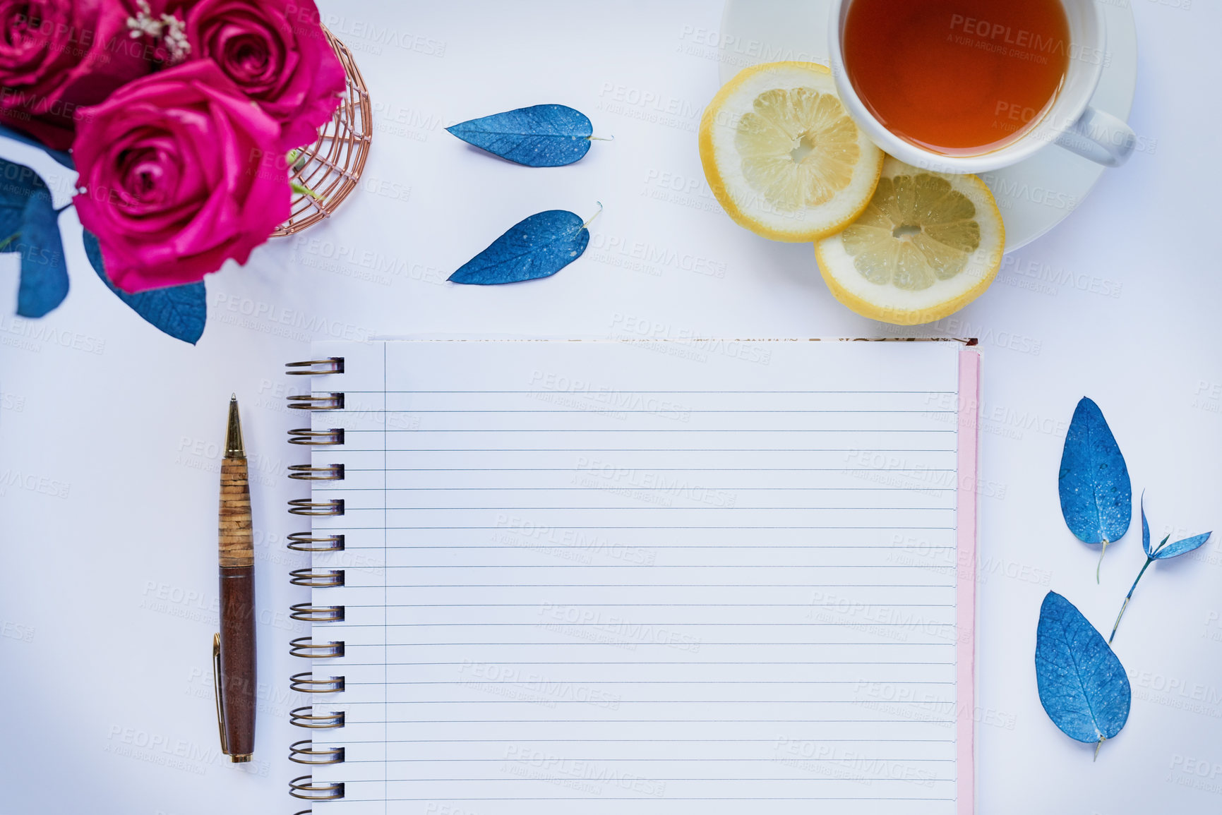 Buy stock photo Above, tea and relax with notebook in studio for diary, vision board and agenda planning. Flowers, inspiration and daily affirmations with paper mockup on white background for peace, writing or list