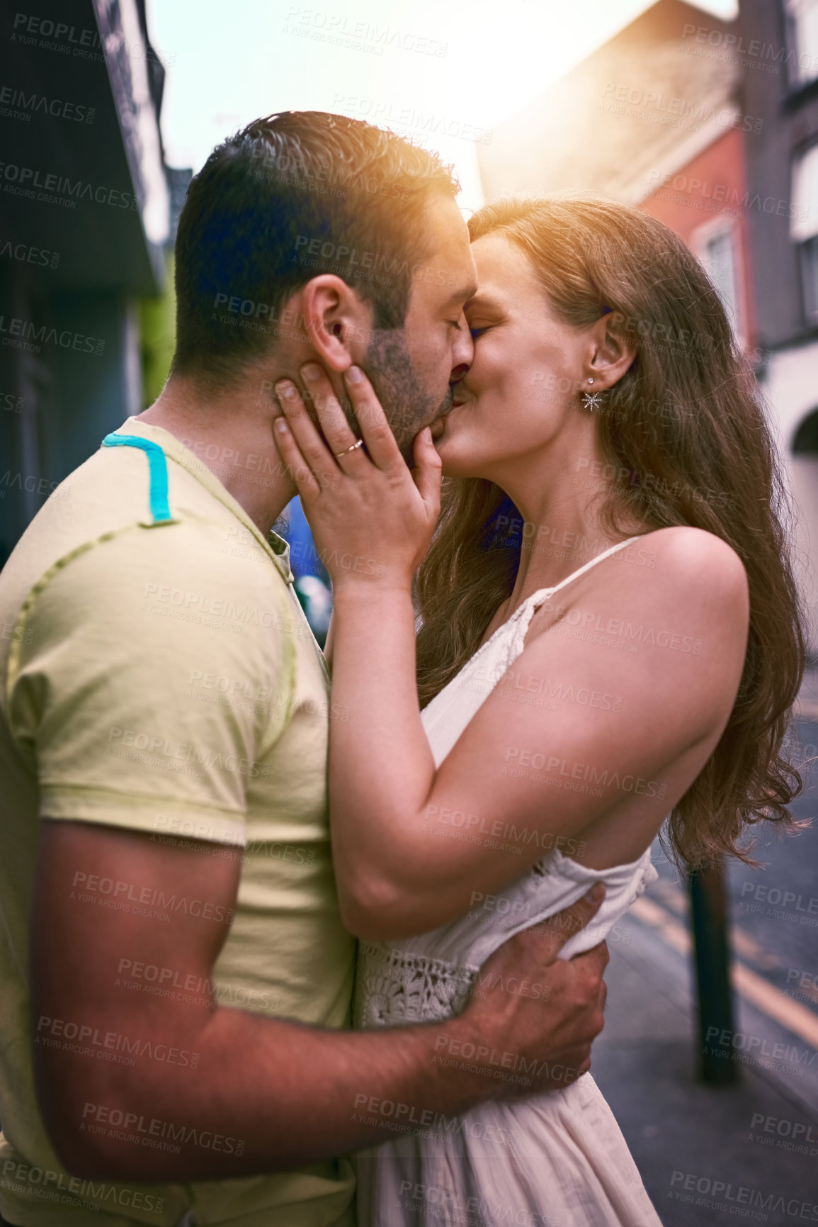 Buy stock photo Vacation, couple and love with kiss, smile and urban journey on holiday, adventure or honeymoon. Travel, man and happy woman with romance in city for Europe, street tourism and sightseeing together