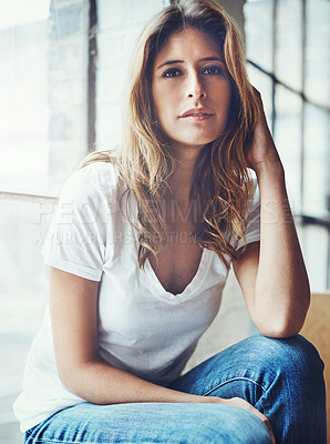 Buy stock photo Portrait of an attractive young woman relaxing at home