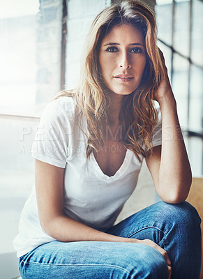 Buy stock photo Portrait of an attractive young woman relaxing at home