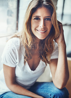 Buy stock photo Portrait of an attractive young woman relaxing at home