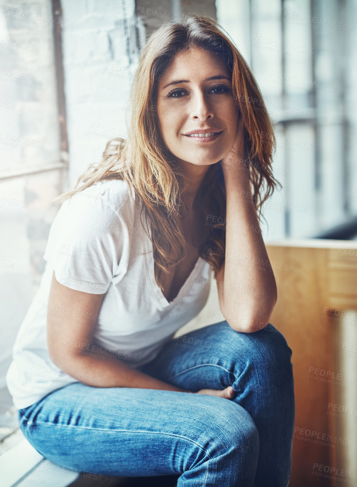 Buy stock photo Portrait of an attractive young woman relaxing at home