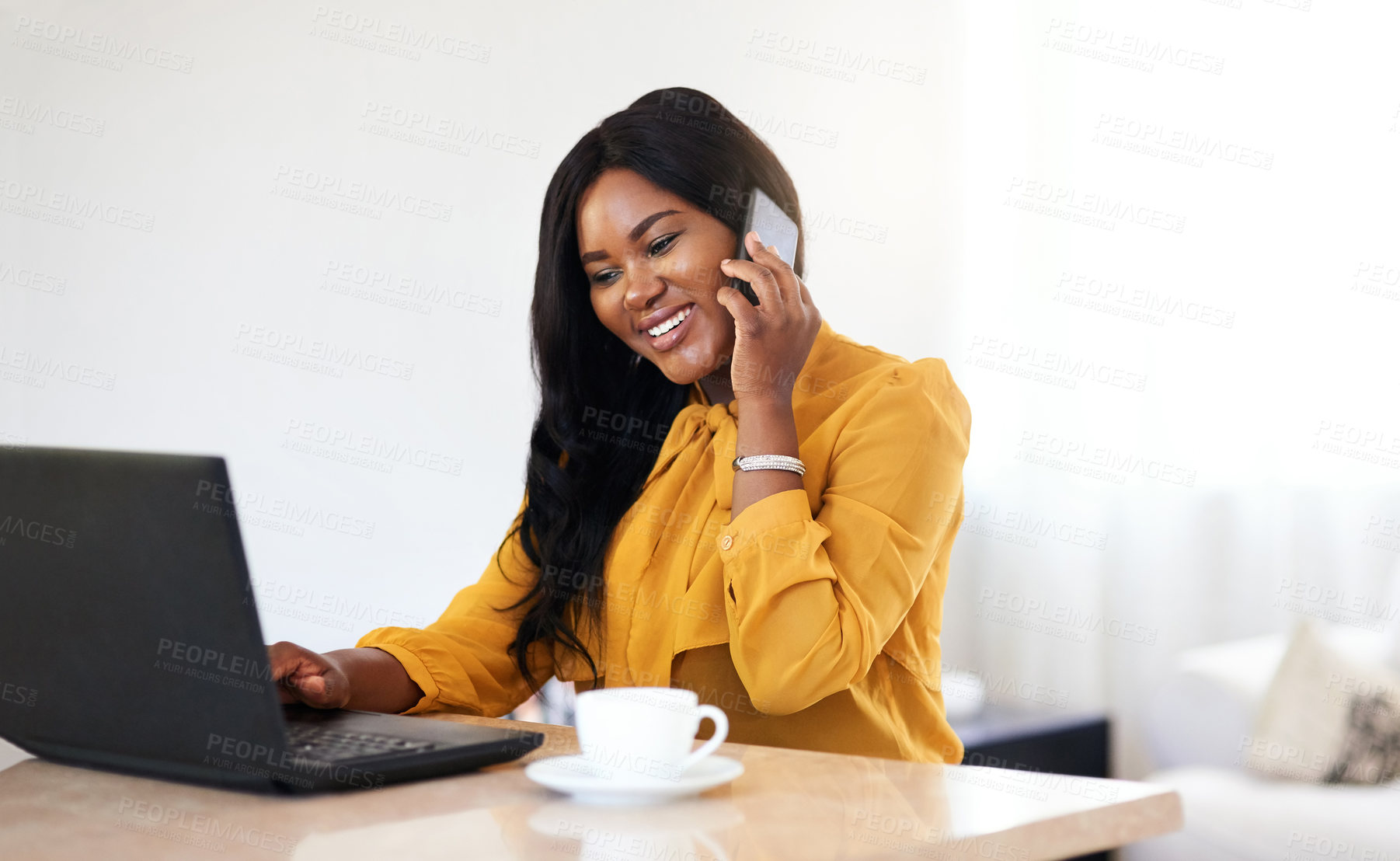 Buy stock photo Home, coffee and laptop of black woman in phone call for discussion, communication and technology to connect. Freelancer, businesswoman and smartphone for talking with clients, computer or beverage 