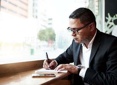 Buy stock photo Coffee shop, business and man writing, notebook and doodle with professional and PR consultant. Person, ideas and guy in restaurant, paperwork and sign contract with schedule or journal with planning