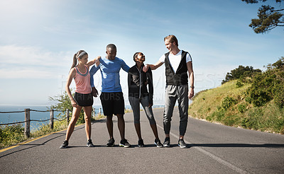 Buy stock photo Shot of a group of people out exercising together