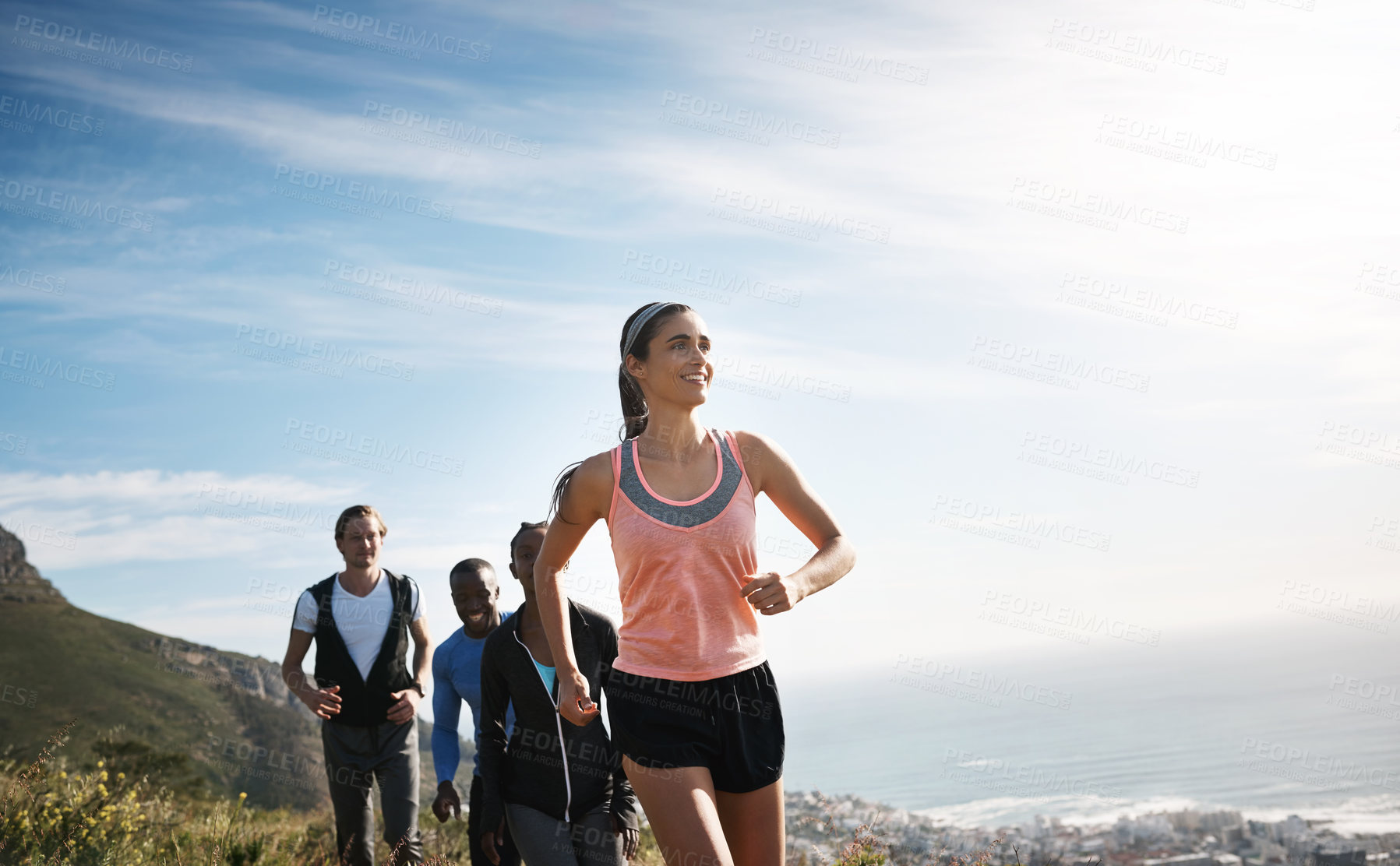 Buy stock photo People, running and together with happiness on mountain or hill for support, diversity or exercise. Group, freedom and excited in workout, health club or sport team for outdoor adventure or training