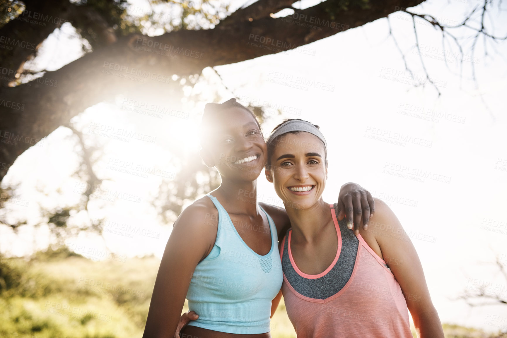 Buy stock photo Interracial women, portrait or friends with hug in nature for fitness workout or outdoor hiking by tree. Young, female people or smile with embrace, support or trust for exercise or training together