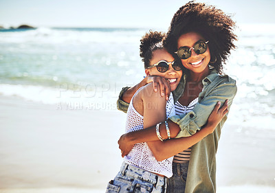 Buy stock photo Shot of two girlfriends enjoying themselves at the beach
