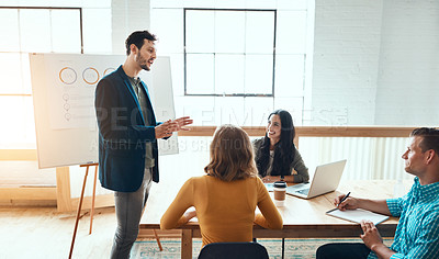 Buy stock photo Business people, group and leader with presentation for discussion, meeting or brainstorming ideas. Presenter, team or sales manager training with financial data, analysis or project stats in startup